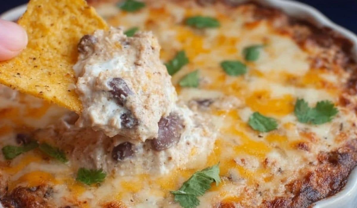 Healthy Easy Bean Dip with melted cheese and tortilla chip