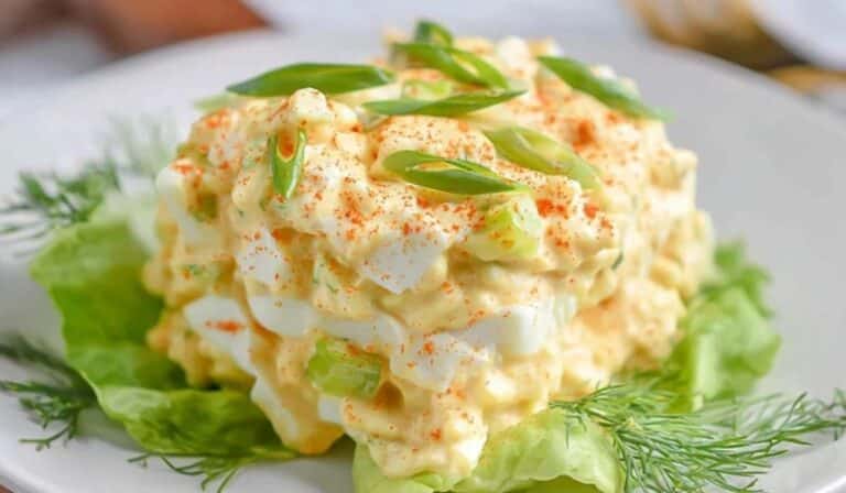 Keto deviled egg salad with paprika and scallions on lettuce