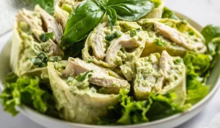 Delicious Pesto Chicken Salad served with fresh greens and basil