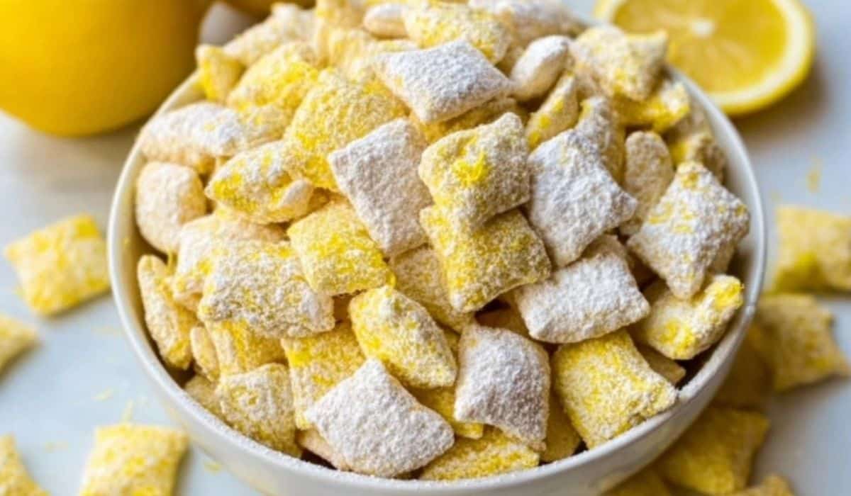 Zesty Lemonade Puppy Chow Snack Recipe with powdered sugar coating