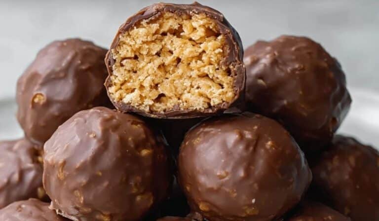 Crispy Rice Peanut Butter Treats stacked and coated in chocolate