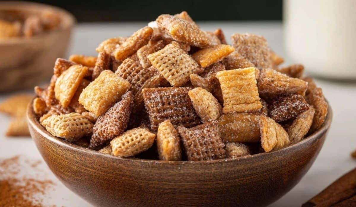Sweet and Crunchy Churro Chex Mix in a rustic wooden bowl