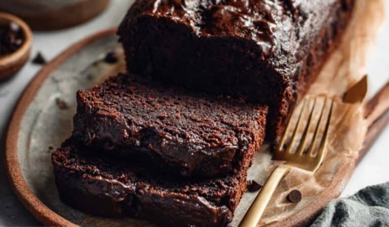 Freshly sliced Double Chocolate Banana Bread on rustic wooden board