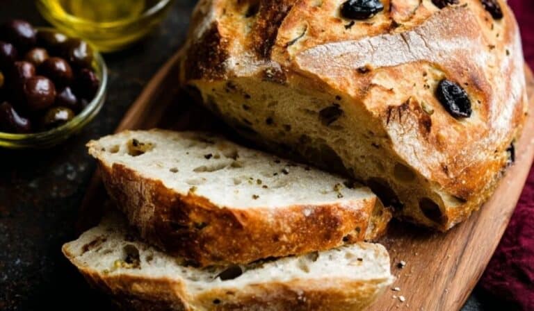 Easy No-Knead Olive Bread served fresh on a wooden board