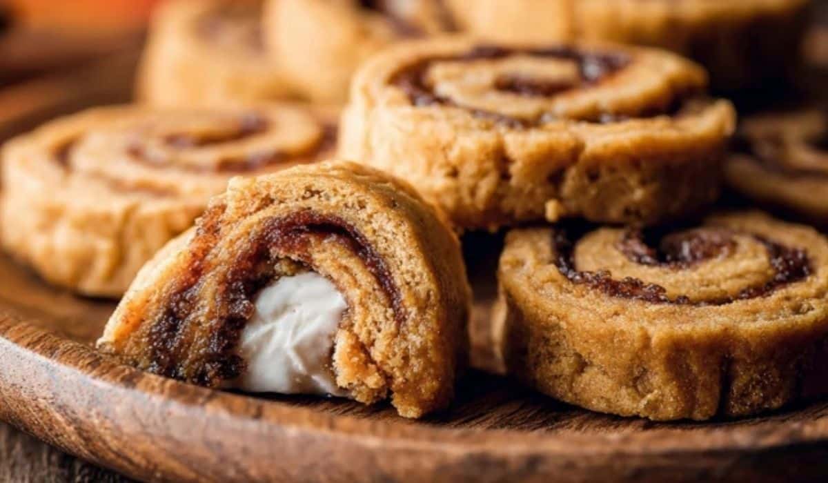 Featured image of Pumpkin Spice Roll Cookies on wooden plate