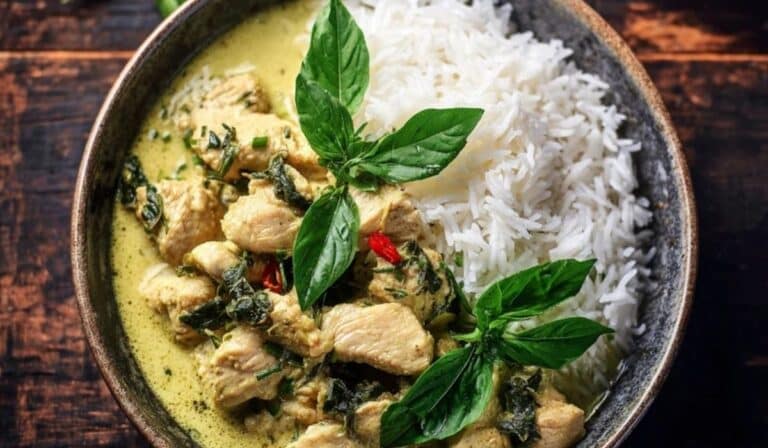 Basil Chicken with Coconut Curry Sauce served in a ceramic bowl