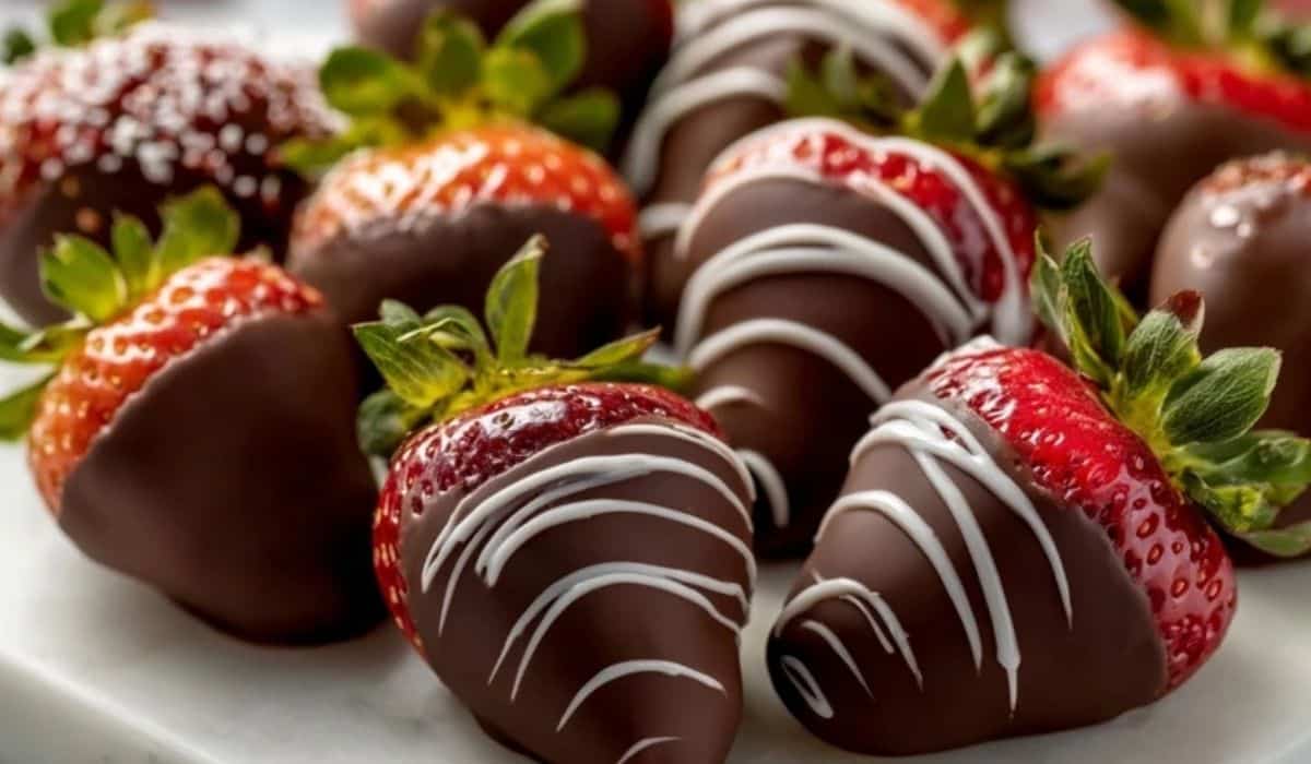 Elegant heart-shaped platter of chocolate-covered strawberries