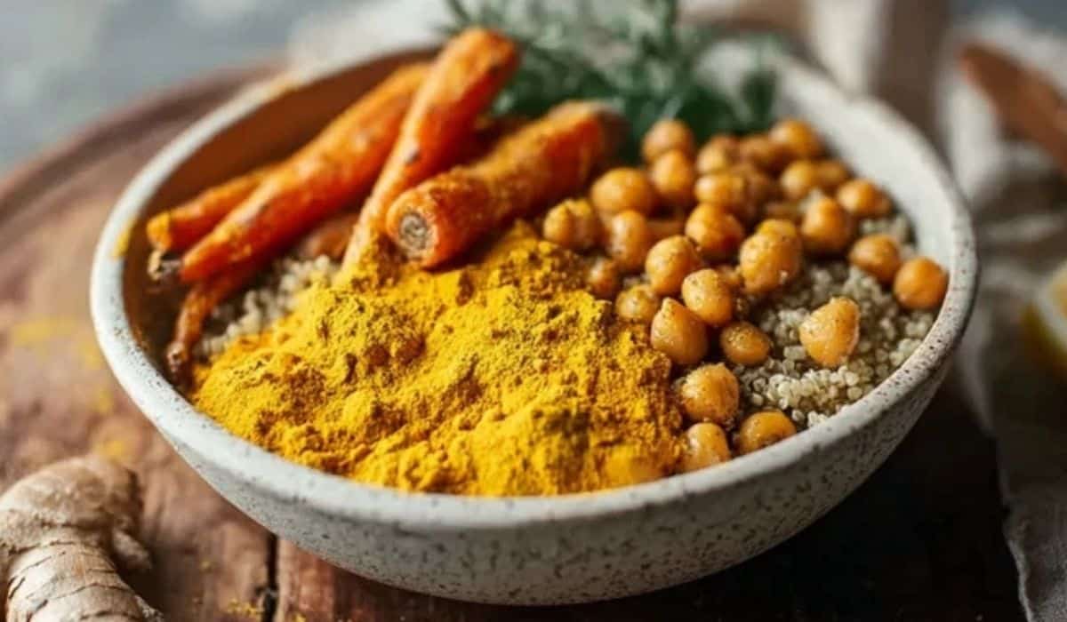 Anti-inflammatory golden turmeric bowl with quinoa and roasted veggies in a white bowl
