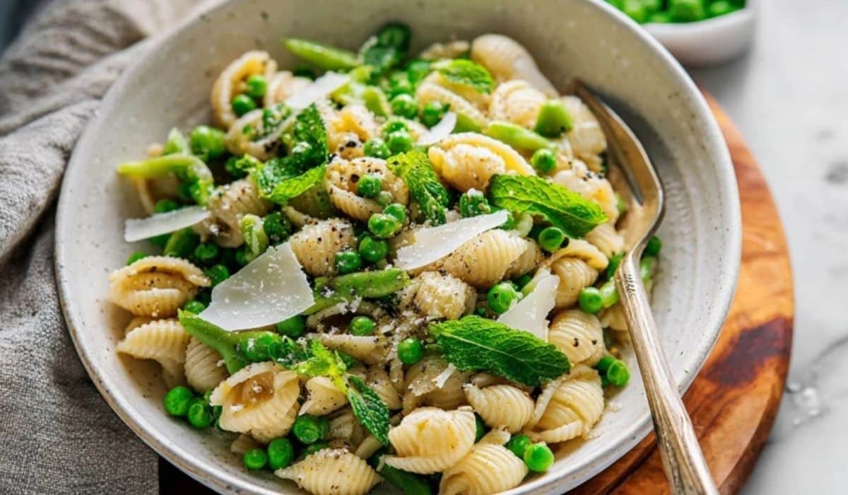 Spring pasta with peas in a lemon parmesan sauce with mint and shaved cheese